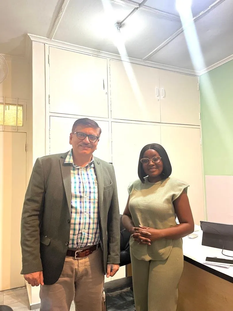 Two people meeting at the Charis office